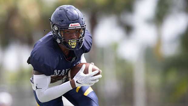 Naples (Fla.) cornerback Jonas Duclona running with the football.